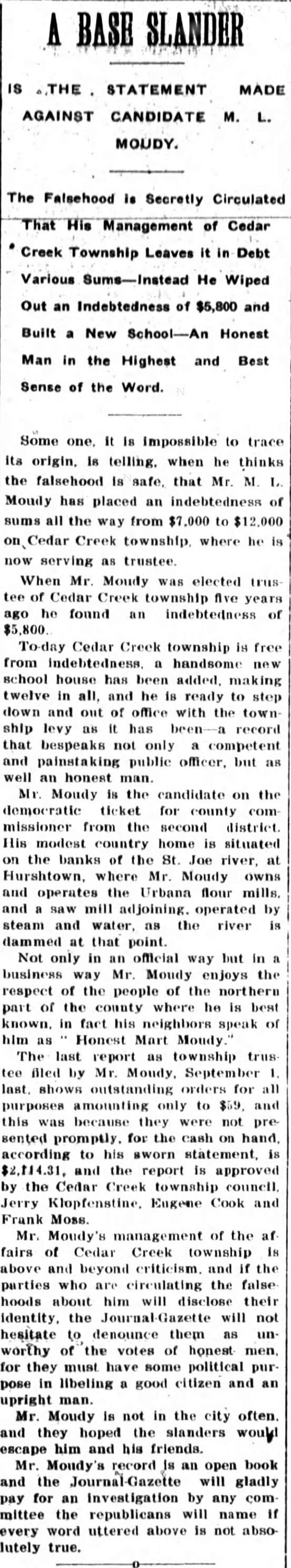 Newspaper clipping: A Base Slander, The Fort Wayne Journal-Gazette, October 27, 1900, front page. A tall single column defending Cedar Creek Township trustee M. L. Moudy against claims that he left the township in debt.